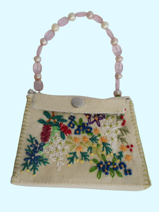Embroidered bag by Lisa Hine on raw canvas